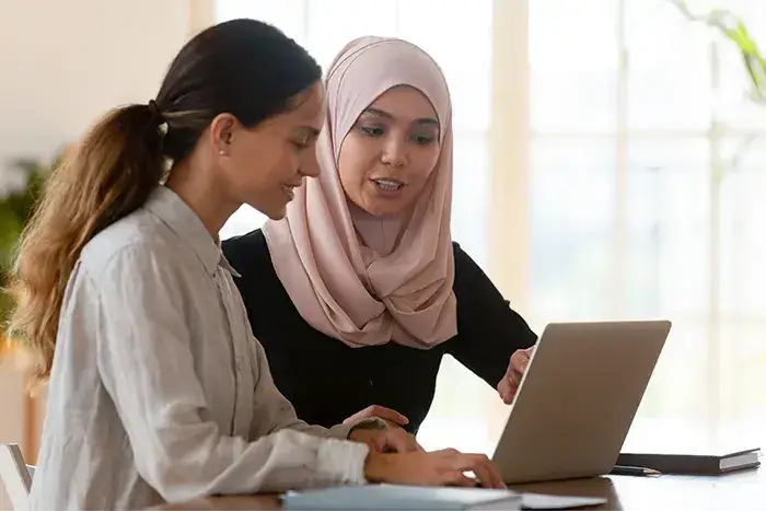 Two Women With Laptop